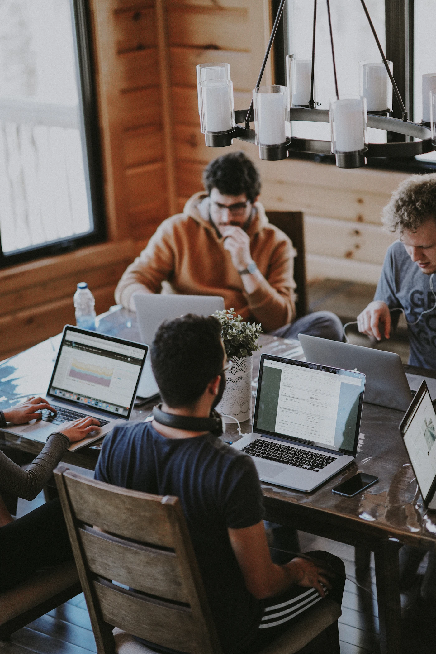 A distributed team on a video standup with overlapping working hours, the practice that removes most time zone risk from offshore staff augmentation